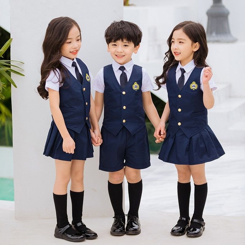 Kids wearing navy blue school academic uniform with tie and blazer – Uniformcraft Dubai